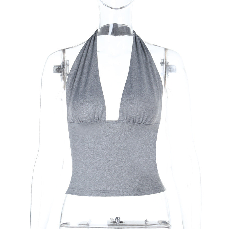 Damer elegant halterneck topp med djup V-ringning och figursydd passform Mirla-Eva Jonsson