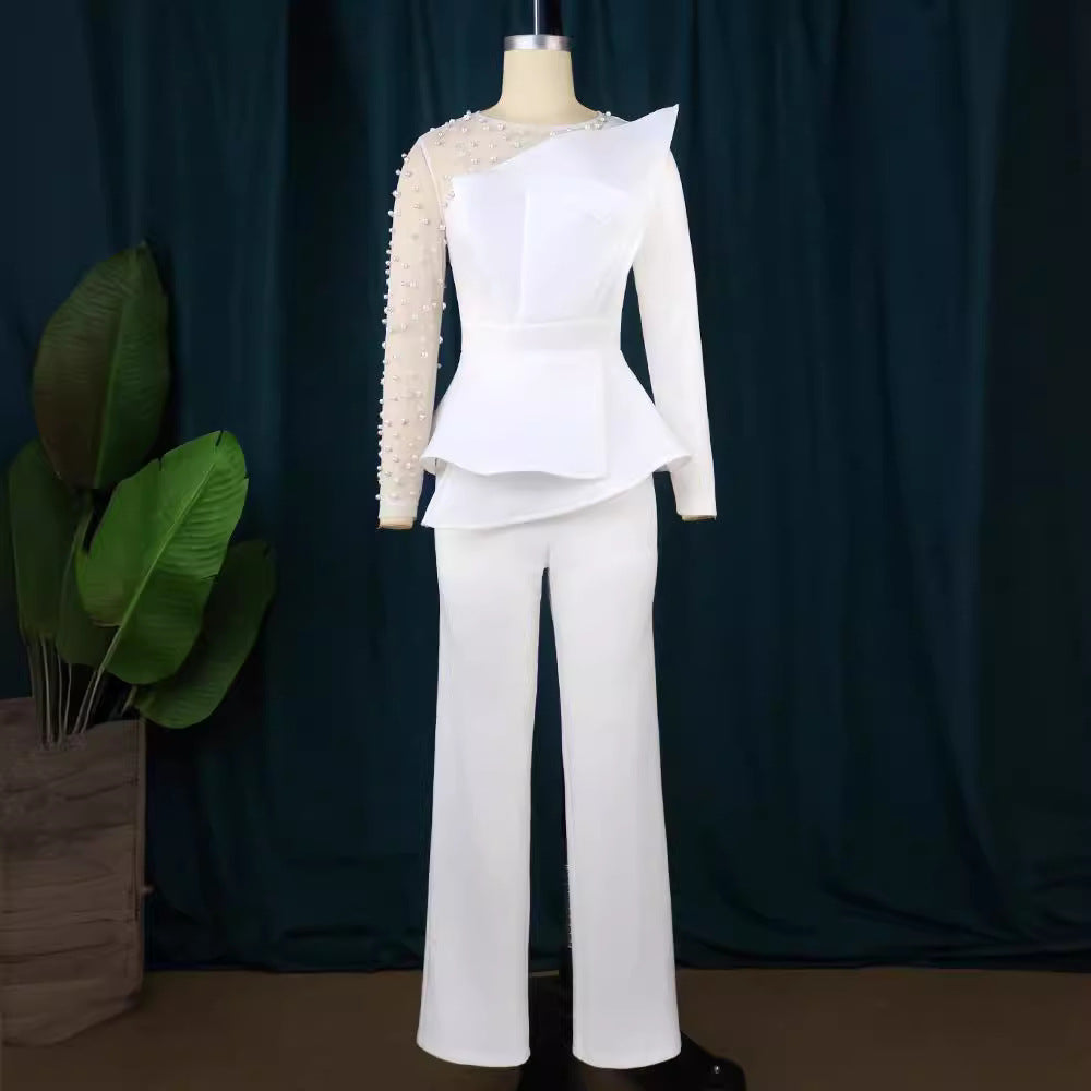 Damer elegant jumpsuit med asymmetrisk överdel och raffinerad volangdesign Mirla-Eva Jonsson