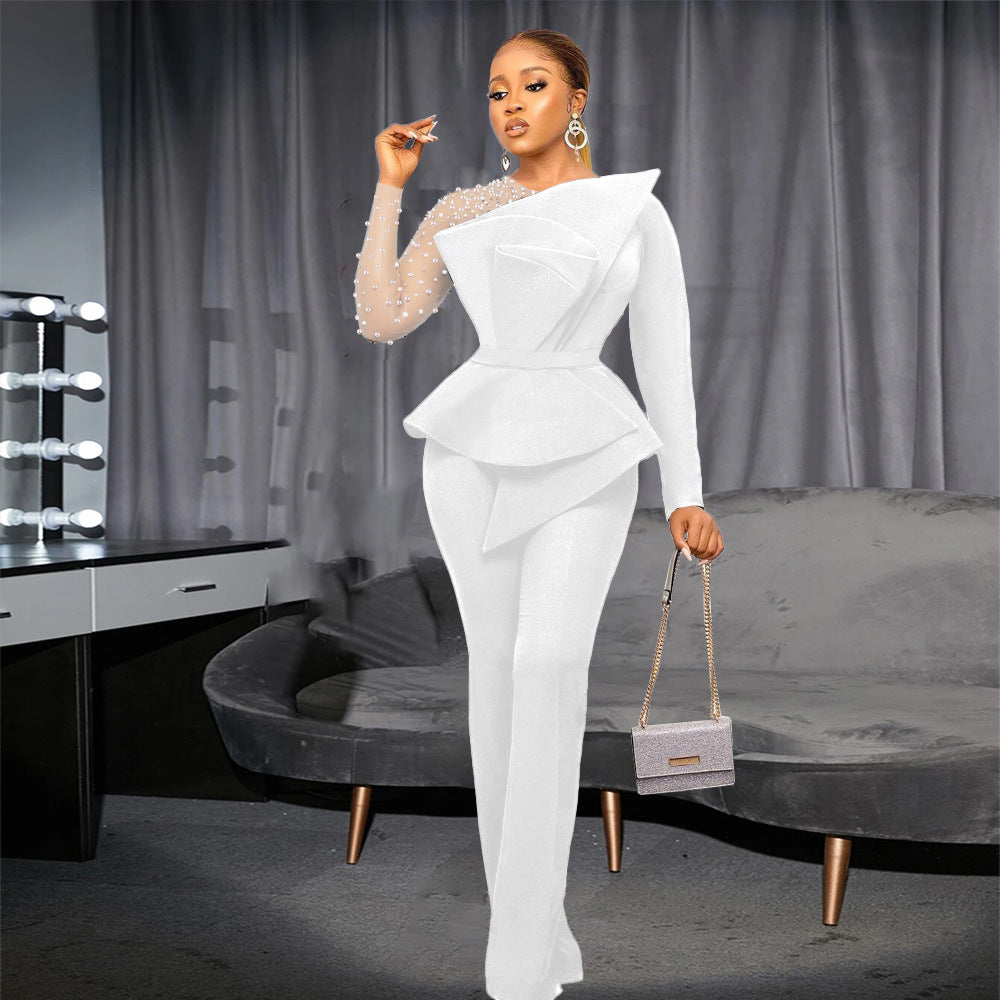 Damer elegant jumpsuit med asymmetrisk överdel och raffinerad volangdesign Mirla-Eva Jonsson
