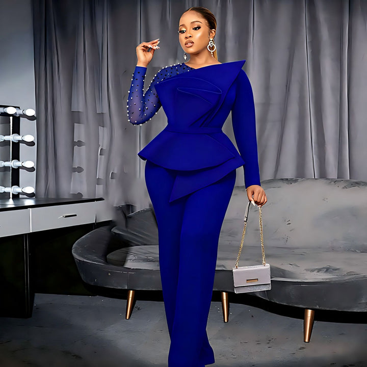 Damer elegant jumpsuit med asymmetrisk överdel och raffinerad volangdesign Mirla-Eva Jonsson