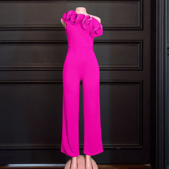 Damer elegant jumpsuit med asymmetrisk skärning och voluminösa ruffledetaljer Mirla-Eva Jonsson
