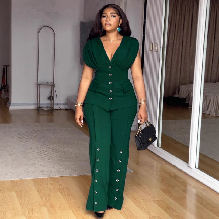 Damer elegant jumpsuit med djup V-ringning och iögonfallande knappdetaljer Mirla-Eva Jonsson