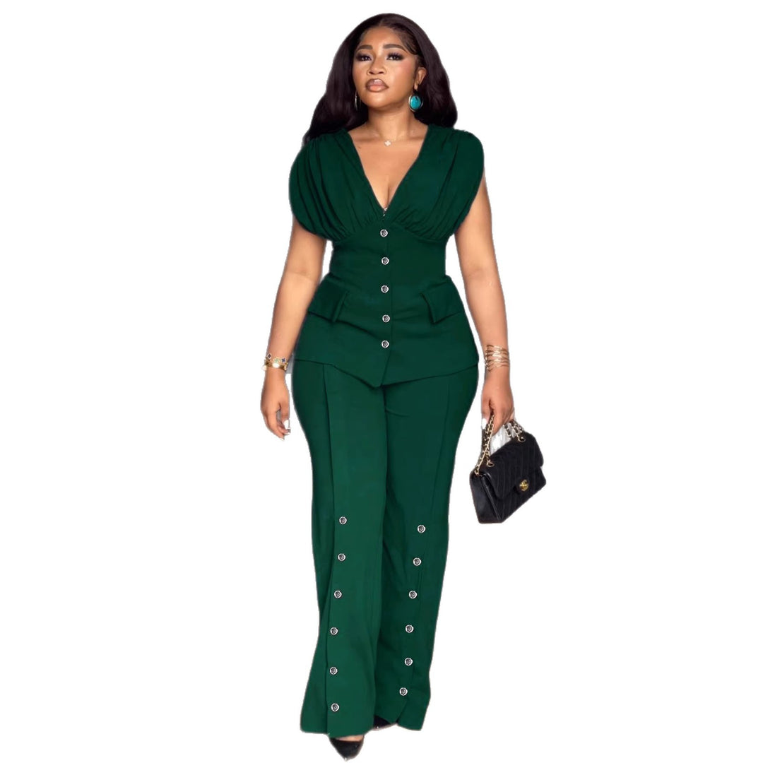Damer elegant jumpsuit med djup V-ringning och iögonfallande knappdetaljer Mirla-Eva Jonsson