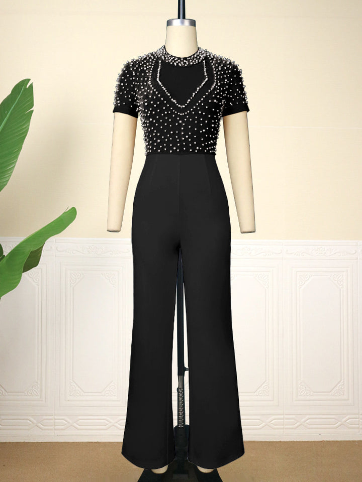 Damer elegant jumpsuit med glittrande pärldetaljer Mirla-Eva Jonsson