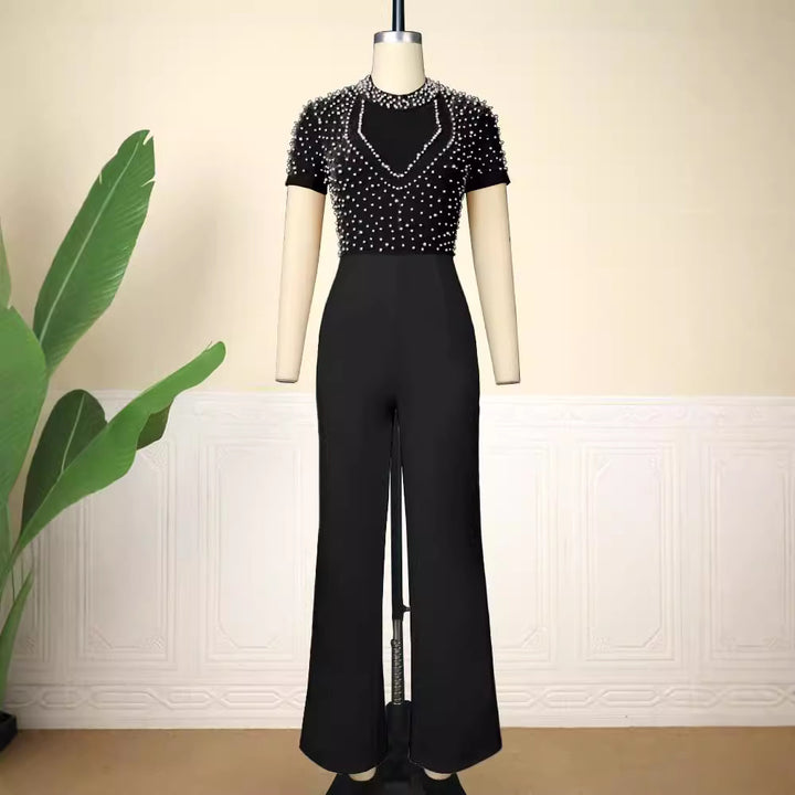 Damer elegant jumpsuit med glittrande pärldetaljer Mirla-Eva Jonsson