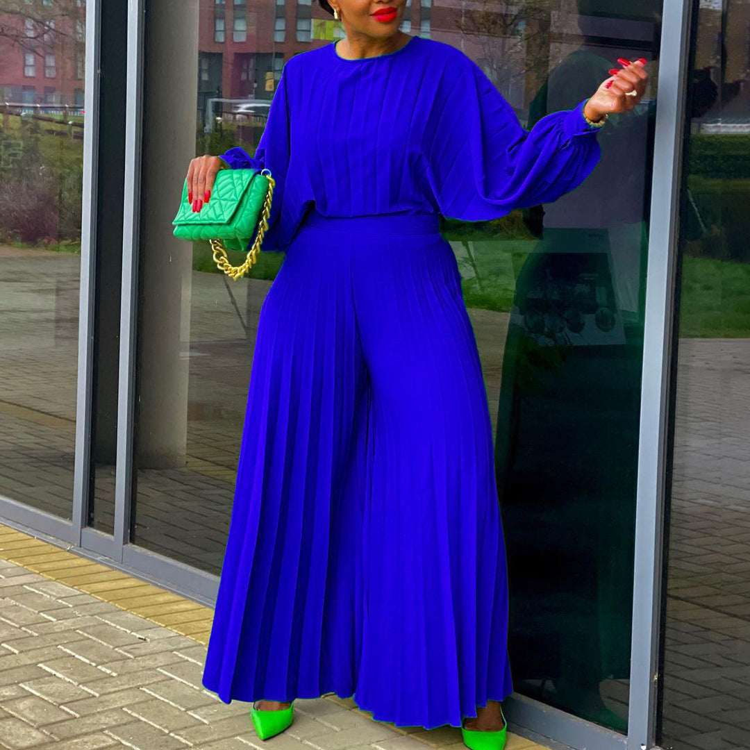 Damer elegant jumpsuit med plissédetaljer och voluminösa ärmar Eva Jonsson-Eva Jonsson