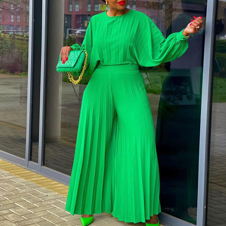 Damer elegant jumpsuit med plissédetaljer och voluminösa ärmar Eva Jonsson-Eva Jonsson