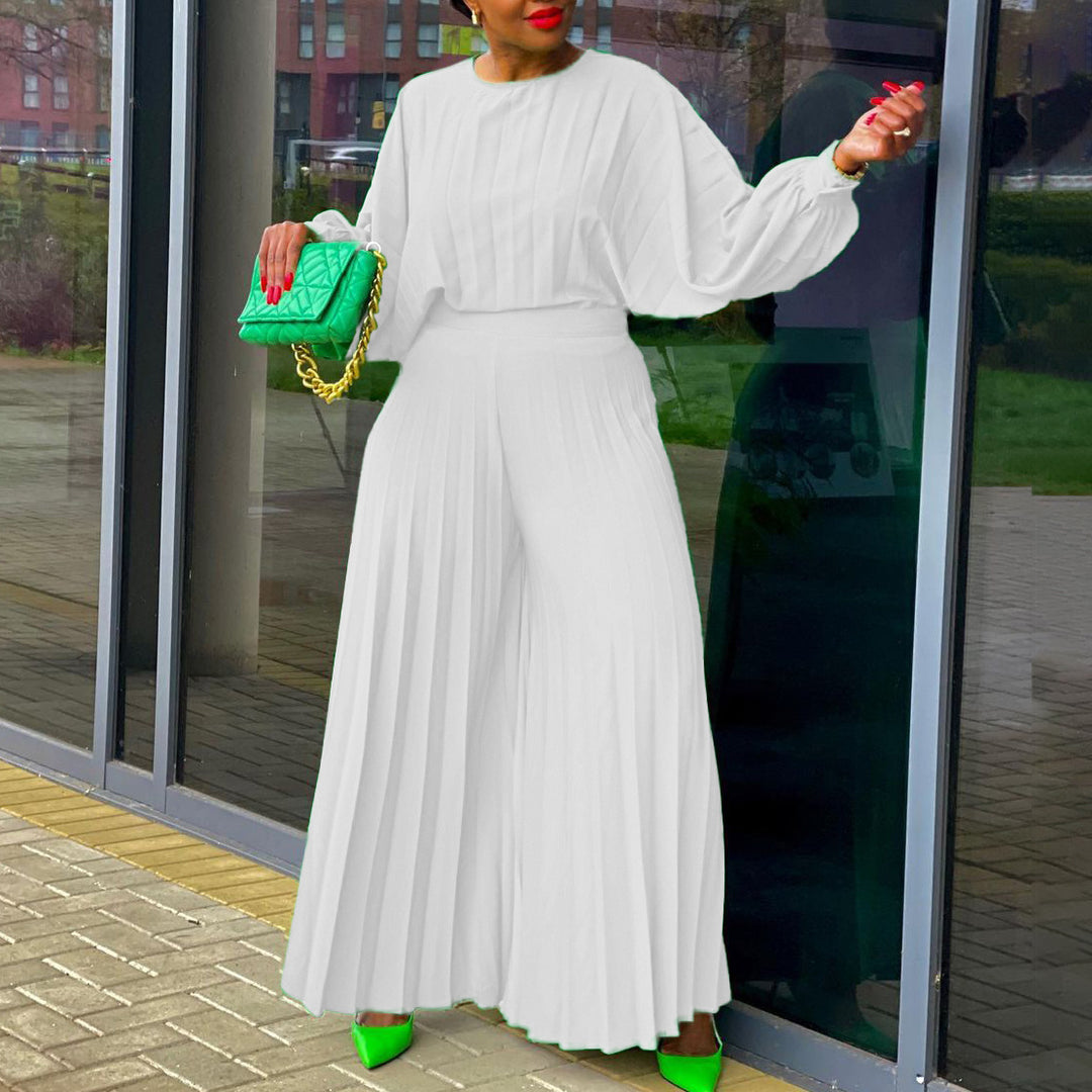 Damer elegant jumpsuit med plissédetaljer och voluminösa ärmar Eva Jonsson-Eva Jonsson