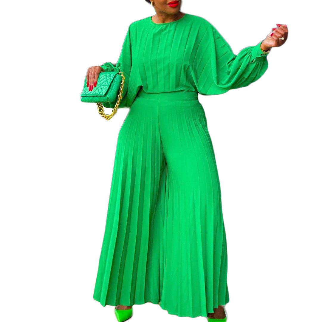 Damer elegant jumpsuit med plissédetaljer och voluminösa ärmar Eva Jonsson-Eva Jonsson