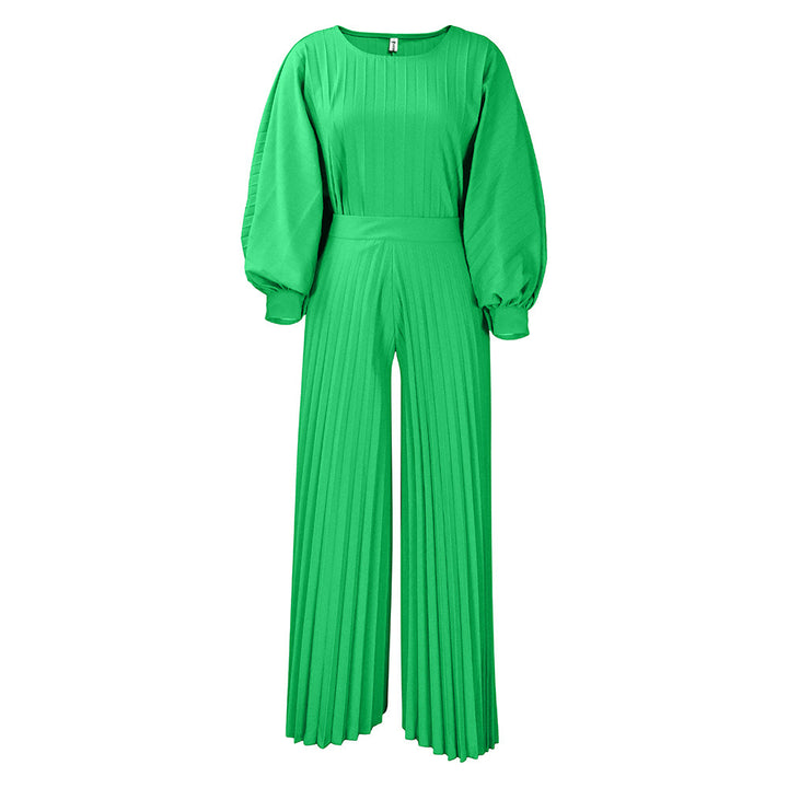 Damer elegant jumpsuit med plissédetaljer och voluminösa ärmar Eva Jonsson-Eva Jonsson