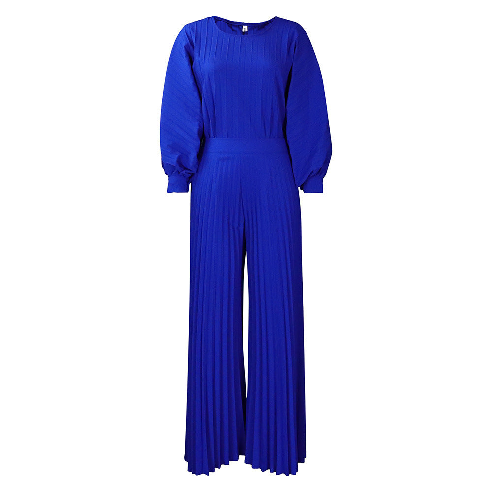 Damer elegant jumpsuit med plissédetaljer och voluminösa ärmar Eva Jonsson-Eva Jonsson