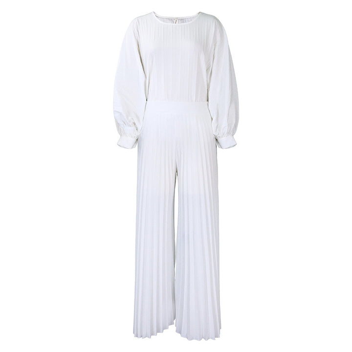 Damer elegant jumpsuit med plissédetaljer och voluminösa ärmar Eva Jonsson-Eva Jonsson
