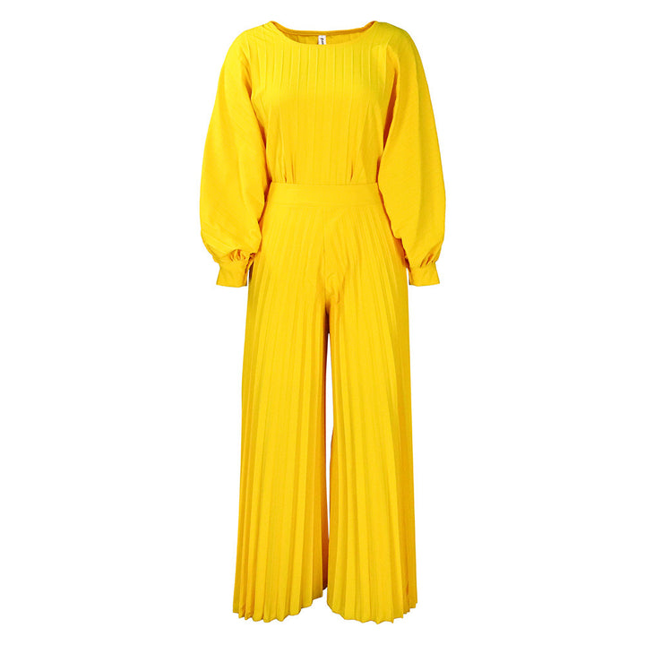 Damer elegant jumpsuit med plissédetaljer och voluminösa ärmar Eva Jonsson-Eva Jonsson