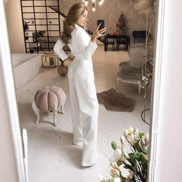 Damer elegant jumpsuit med svängande ben och djup V-ringning Mirla-Eva Jonsson