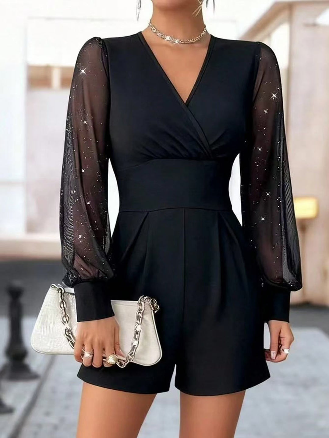 Damer elegant jumpsuit med transparenta puffärmar och V-ringning Mirla-Eva Jonsson