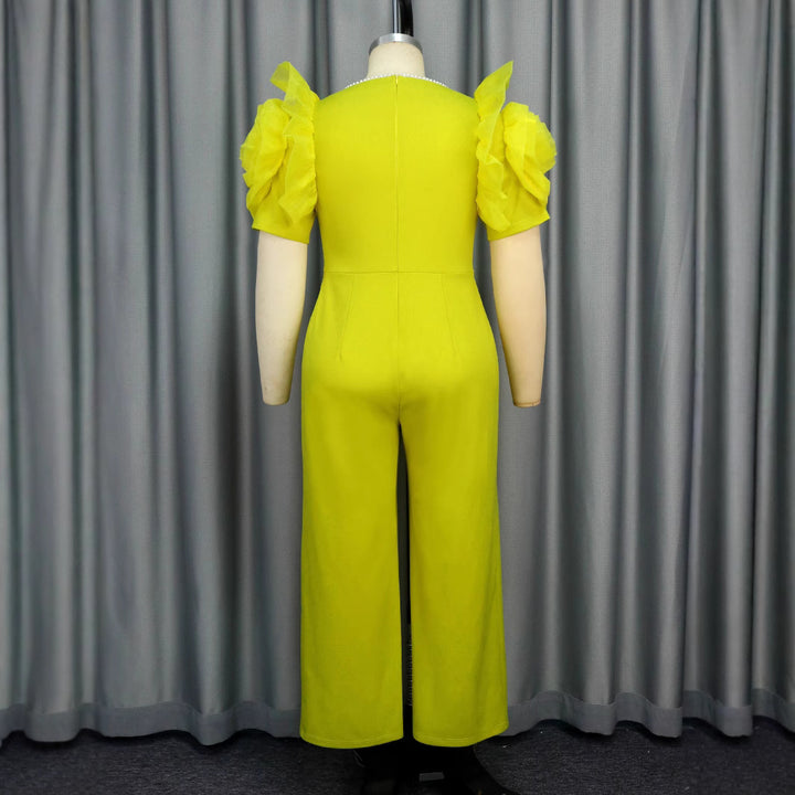 Damer elegant jumpsuit med voluminösa puffärmar och pärlaccent Mirla-Eva Jonsson