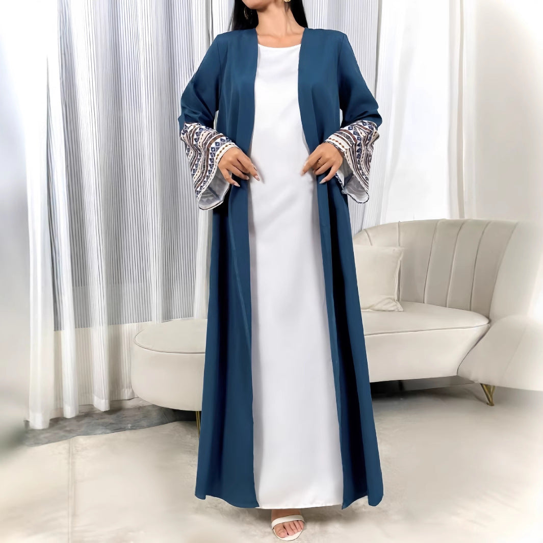 Damer elegant kaftan med konstfulla broderidetaljer och vida ärmar Mirla-Eva Jonsson