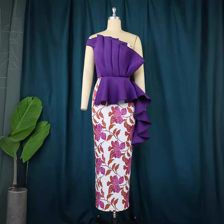 Damer elegant klänning med asymmetrisk volangdesign och blommönster Mirla-Eva Jonsson