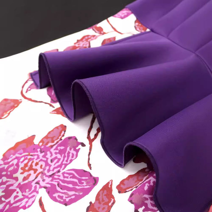 Damer elegant klänning med asymmetrisk volangdesign och blommönster Mirla-Eva Jonsson