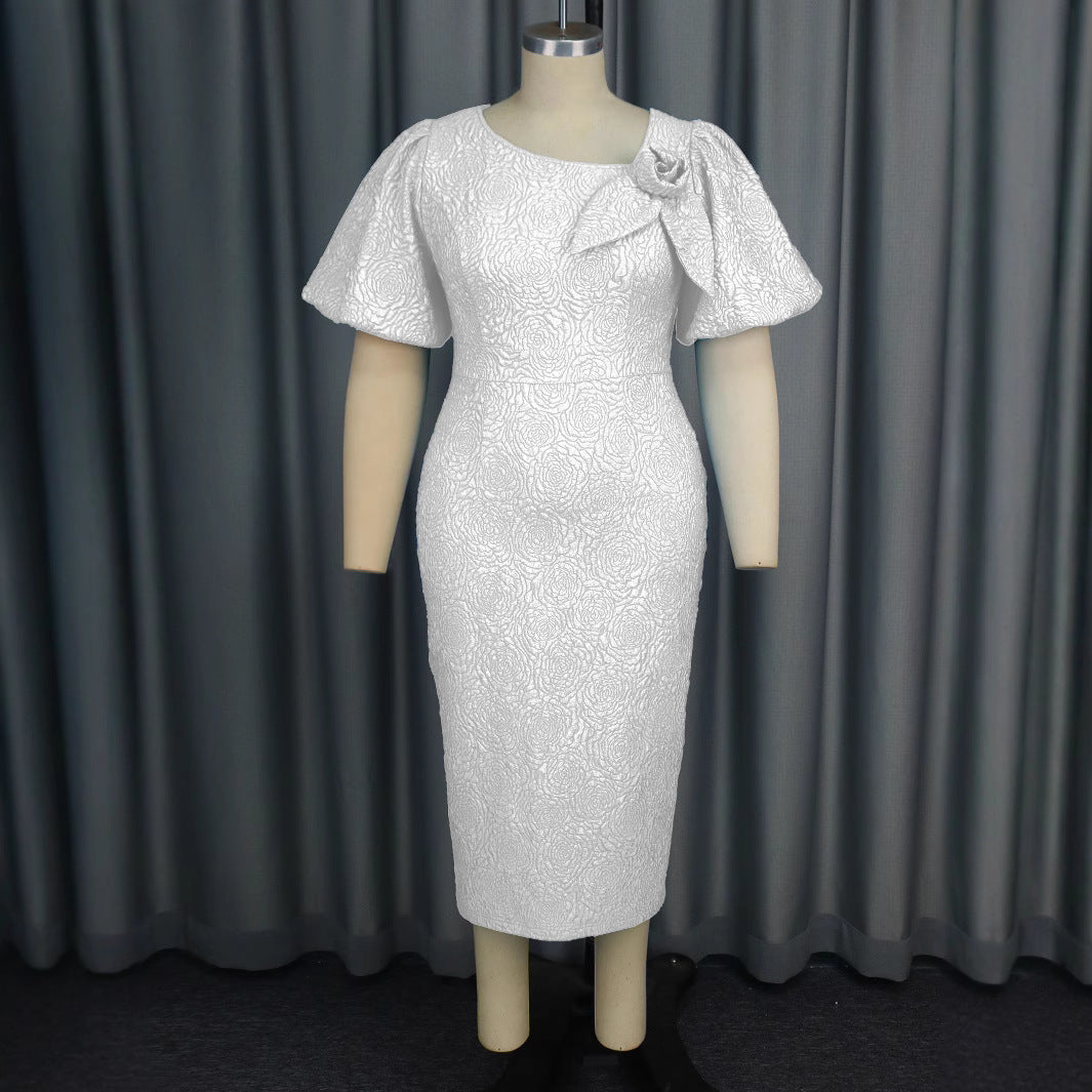 Damer elegant klänning med flödande puffärmar och blomapplikation Mirla-Eva Jonsson