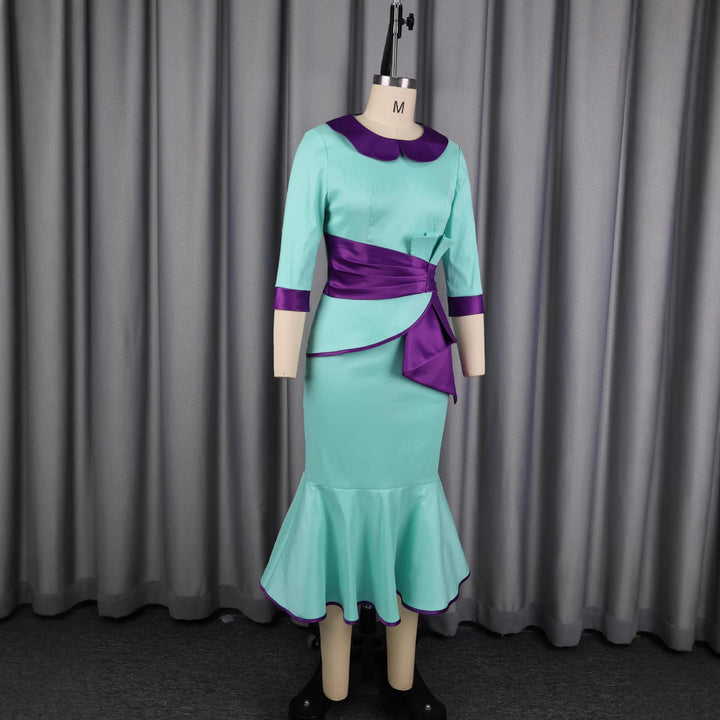 Damer elegant klänning med moderiktig krage och asymmetrisk midjedetalj Mirla-Eva Jonsson