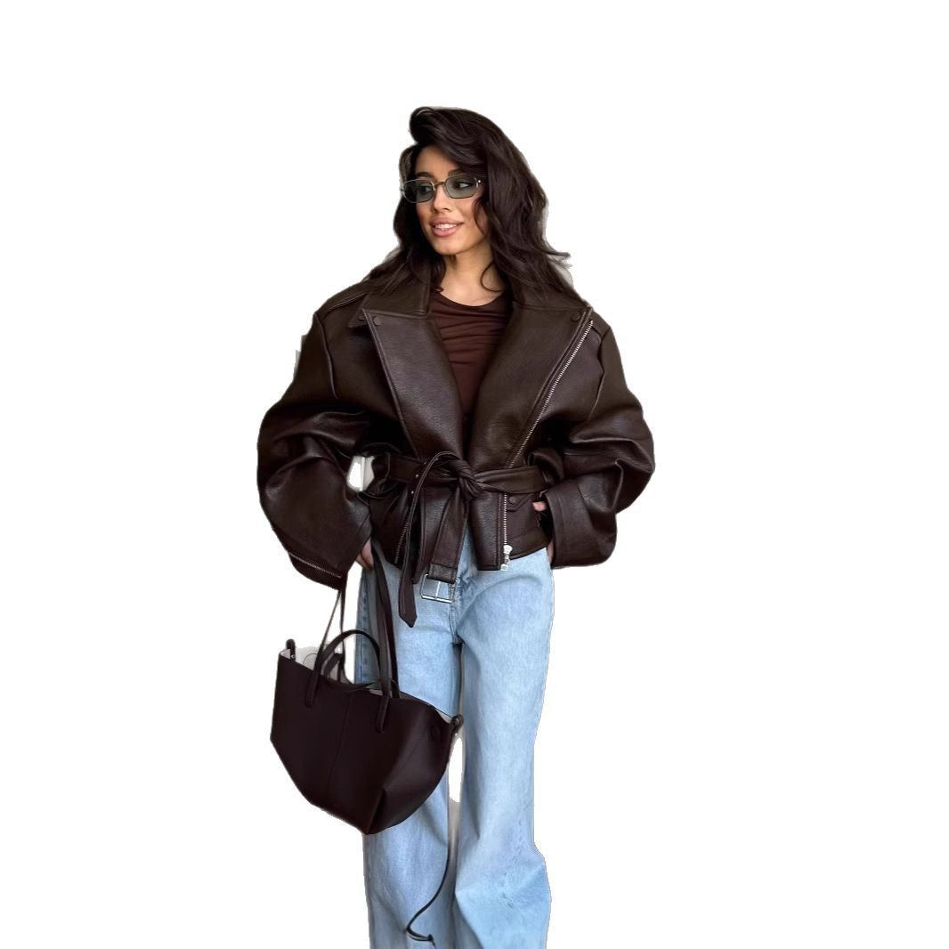 Damer elegant konstläderjacka med bälte och oversized ärmar Mirla-Eva Jonsson