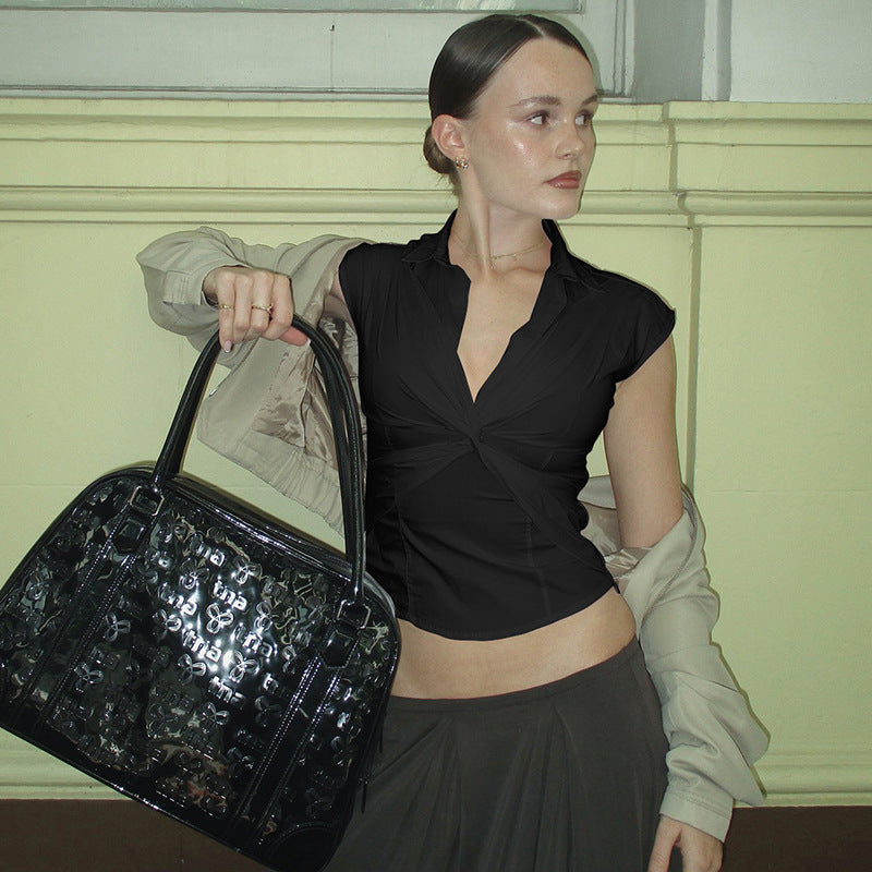 Damer elegant kortärmad blus med knutformad design Mirla-Eva Jonsson