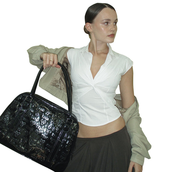 Damer elegant kortärmad blus med knutformad design Mirla-Eva Jonsson