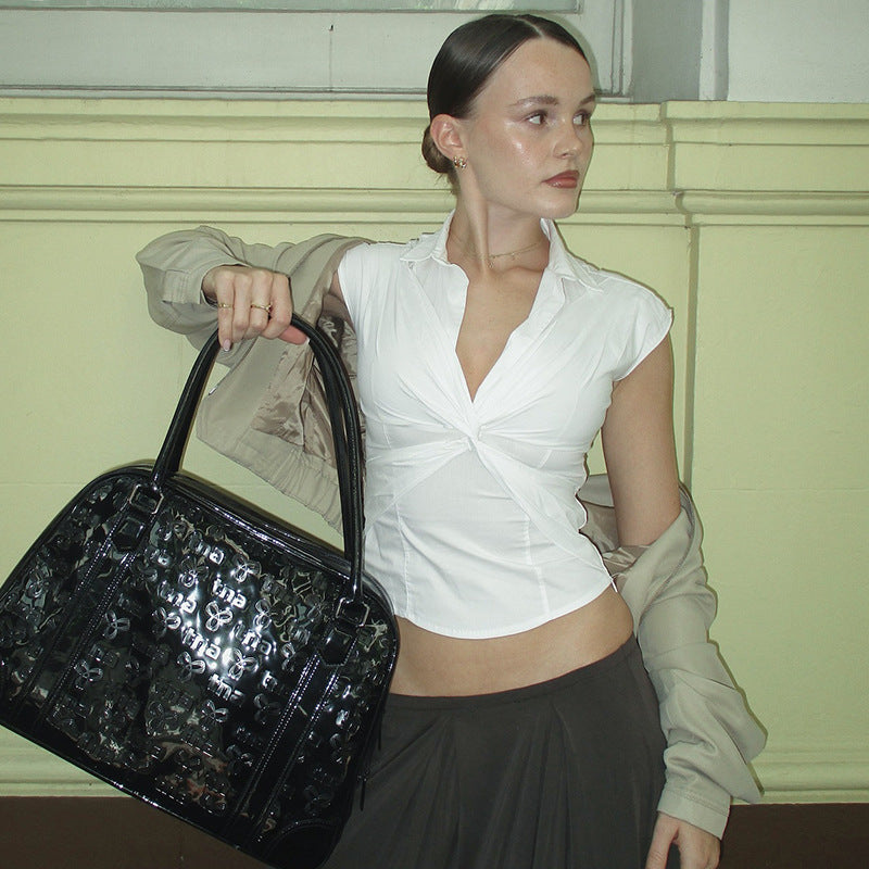 Damer elegant kortärmad blus med knutformad design Mirla-Eva Jonsson