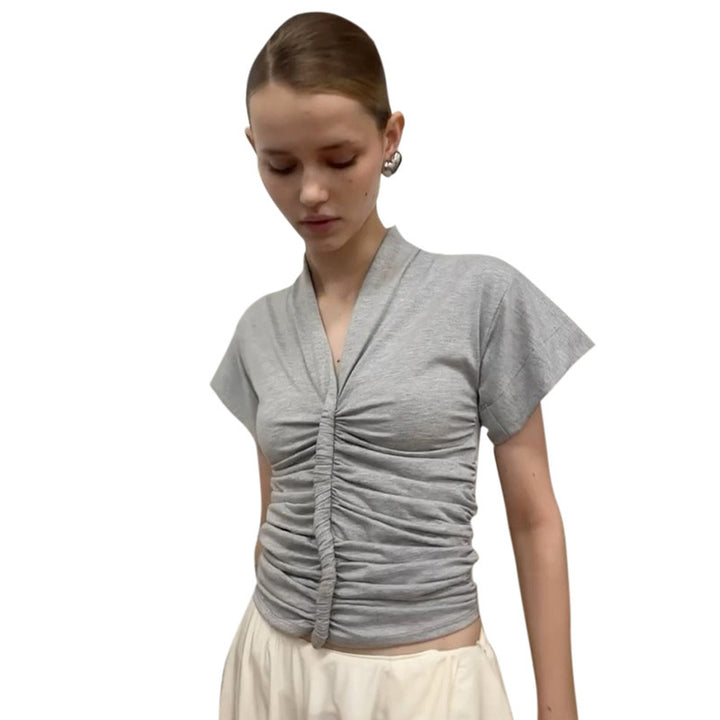Damer elegant kortärmad topp med figurnära drapering Mirla-Eva Jonsson