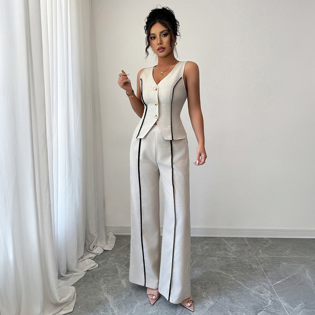 Damer elegant kostymbyxor med figursytt överdel och knapppdetaljer Mirla-Eva Jonsson