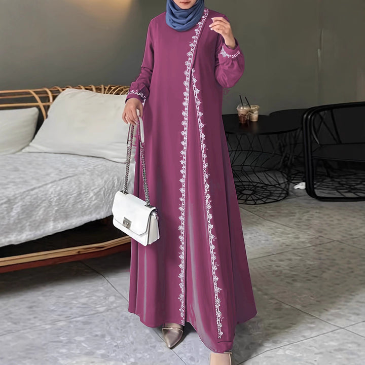 Damer elegant långärmad maxiklänning med broderidetaljer Mirla-Eva Jonsson