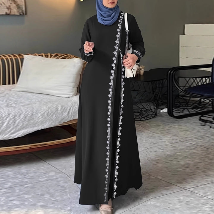 Damer elegant långärmad maxiklänning med broderidetaljer Mirla-Eva Jonsson