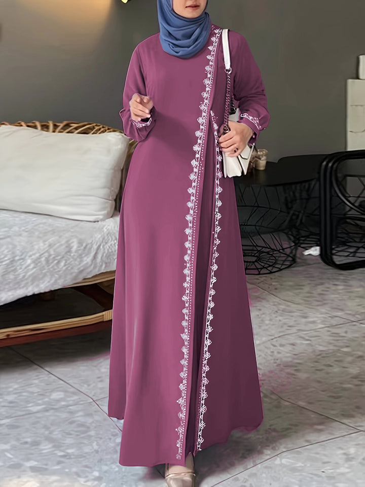 Damer elegant långärmad maxiklänning med broderidetaljer Mirla-Eva Jonsson