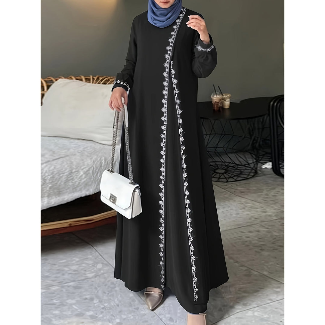 Damer elegant långärmad maxiklänning med broderidetaljer Mirla-Eva Jonsson