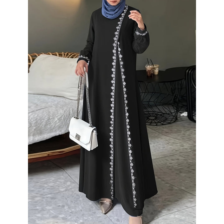Damer elegant långärmad maxiklänning med broderidetaljer Mirla-Eva Jonsson