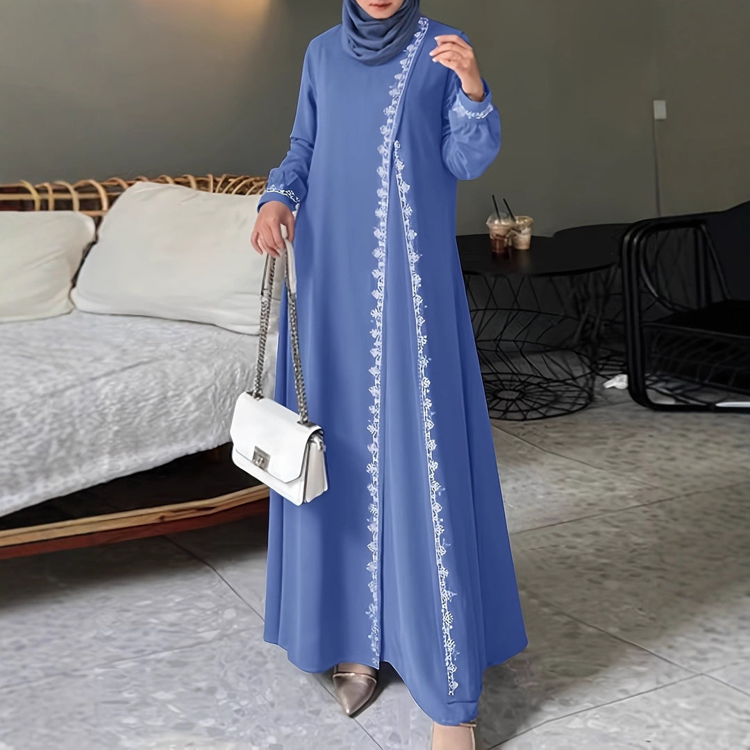 Damer elegant långärmad maxiklänning med broderidetaljer Mirla-Eva Jonsson