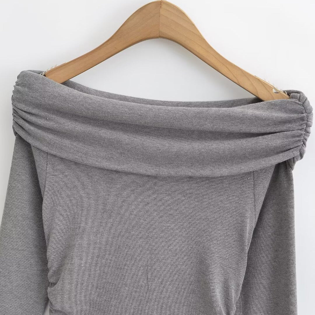 Damer elegant långärmad topp med off-shoulder design och raffinerad volangdetalj Mirla-Eva Jonsson