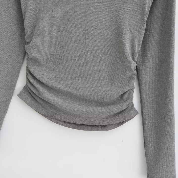 Damer elegant långärmad topp med off-shoulder design och raffinerad volangdetalj Mirla-Eva Jonsson