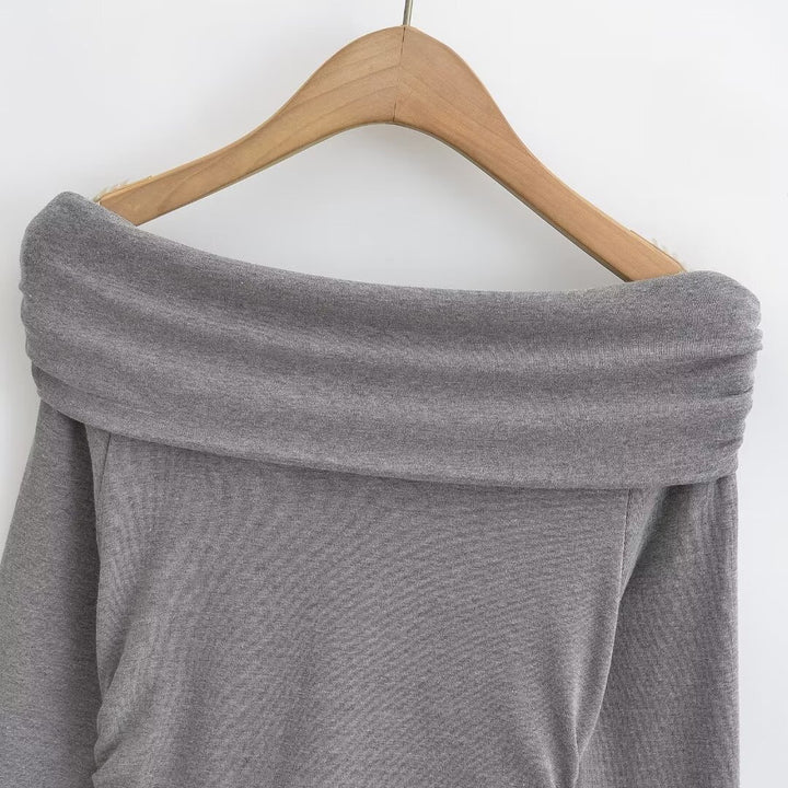 Damer elegant långärmad topp med off-shoulder design och raffinerad volangdetalj Mirla-Eva Jonsson