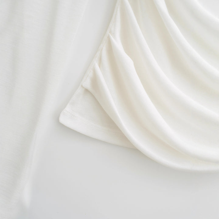 Damer elegant långärmad topp med raffinerad draping Mirla-Eva Jonsson
