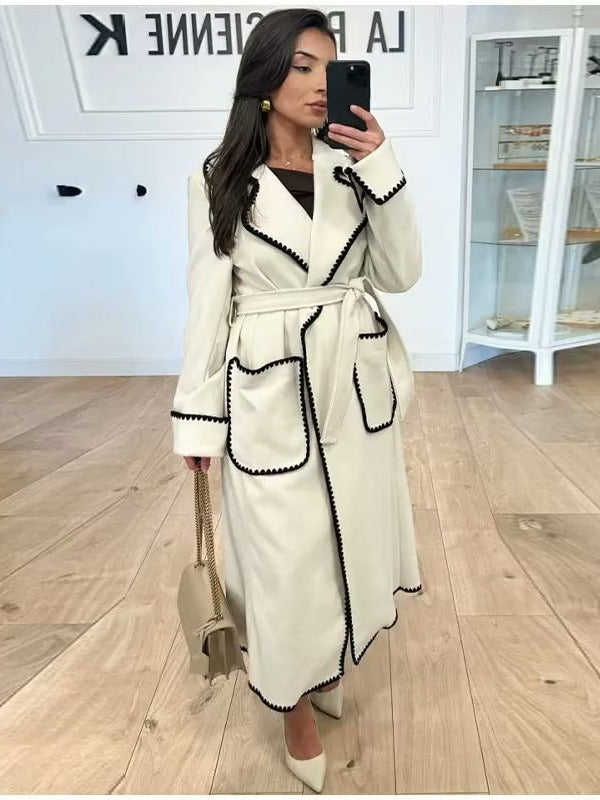 Damer elegant långkappa med bindebälte och kontrasterande passpoaler Mirla-Eva Jonsson