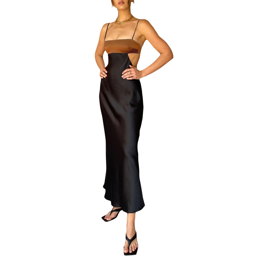 Damer elegant långt klänning med innovativ cut-out design och ömtåliga spaghettiband Mirla-Eva Jonsson