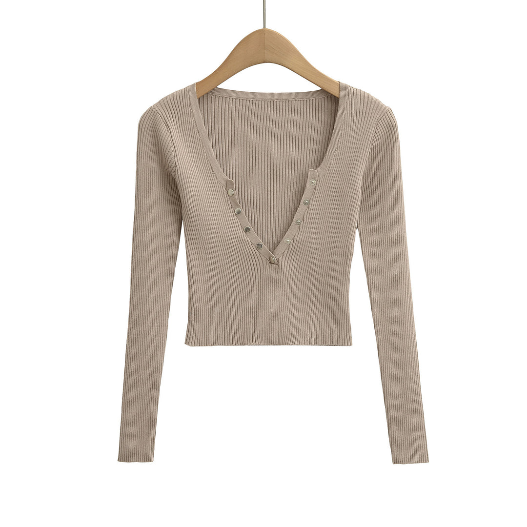 Damer elegant longsleeve med raffinerad V-hals och dekorativa knappar Mirla-Eva Jonsson
