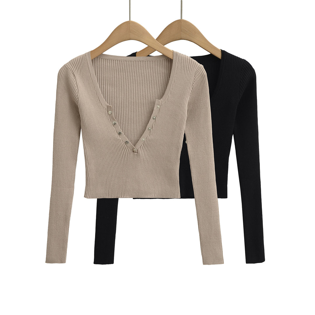Damer elegant longsleeve med raffinerad V-hals och dekorativa knappar Mirla-Eva Jonsson