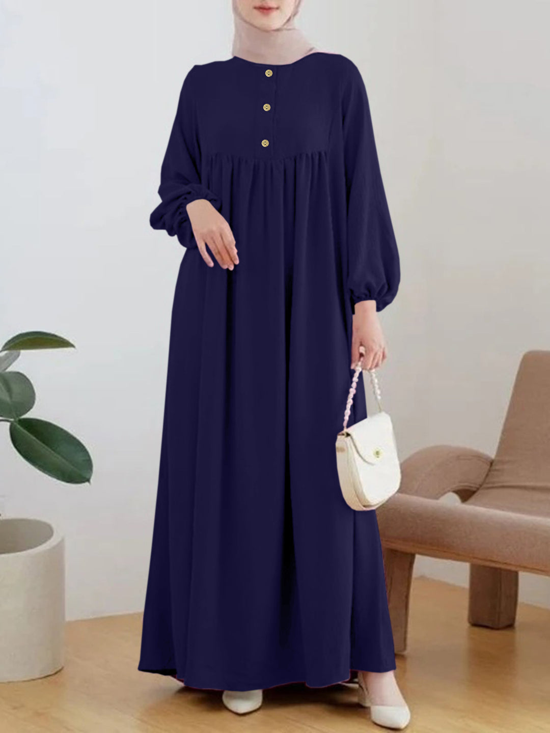 Damer elegant maxikjol med knappdetalj och voluminösa ärmar Mirla-Eva Jonsson