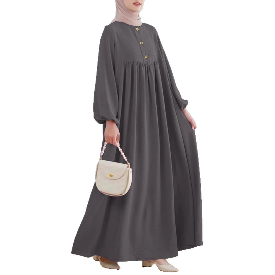 Damer elegant maxikjol med knappdetalj och voluminösa ärmar Mirla-Eva Jonsson
