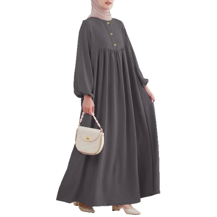 Damer elegant maxikjol med knappdetalj och voluminösa ärmar Mirla-Eva Jonsson