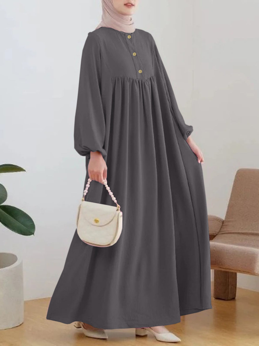 Damer elegant maxikjol med knappdetalj och voluminösa ärmar Mirla-Eva Jonsson