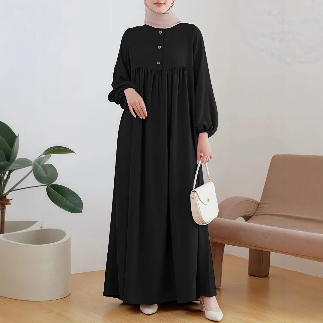 Damer elegant maxikjol med knappdetalj och voluminösa ärmar Mirla-Eva Jonsson
